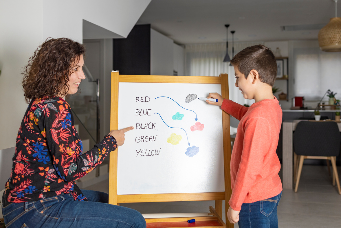 Little Boy Learning Colors with His Mother at Home